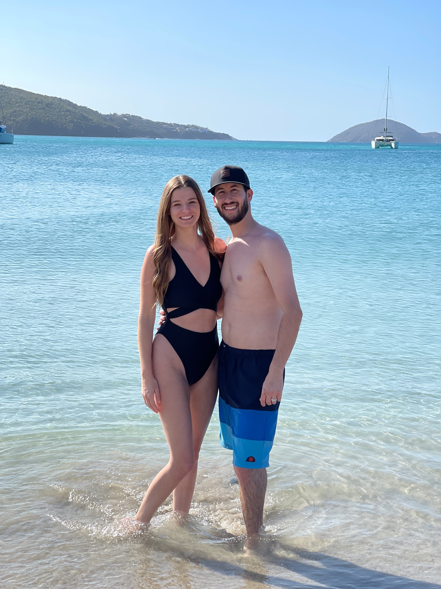 Molly and Jaren standing in the ocean at Magens Bay Beach