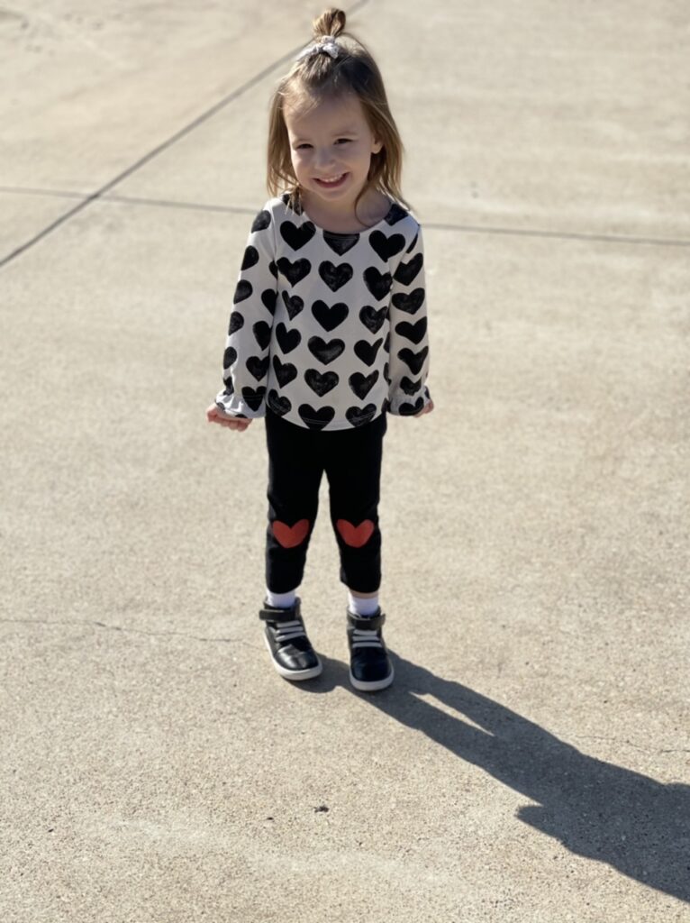 Willow wearing a heart outfit at her grandparents house