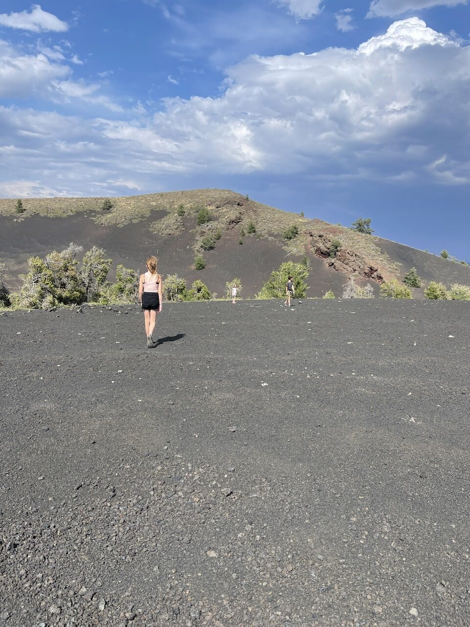 Grass hill with volcanic rocks